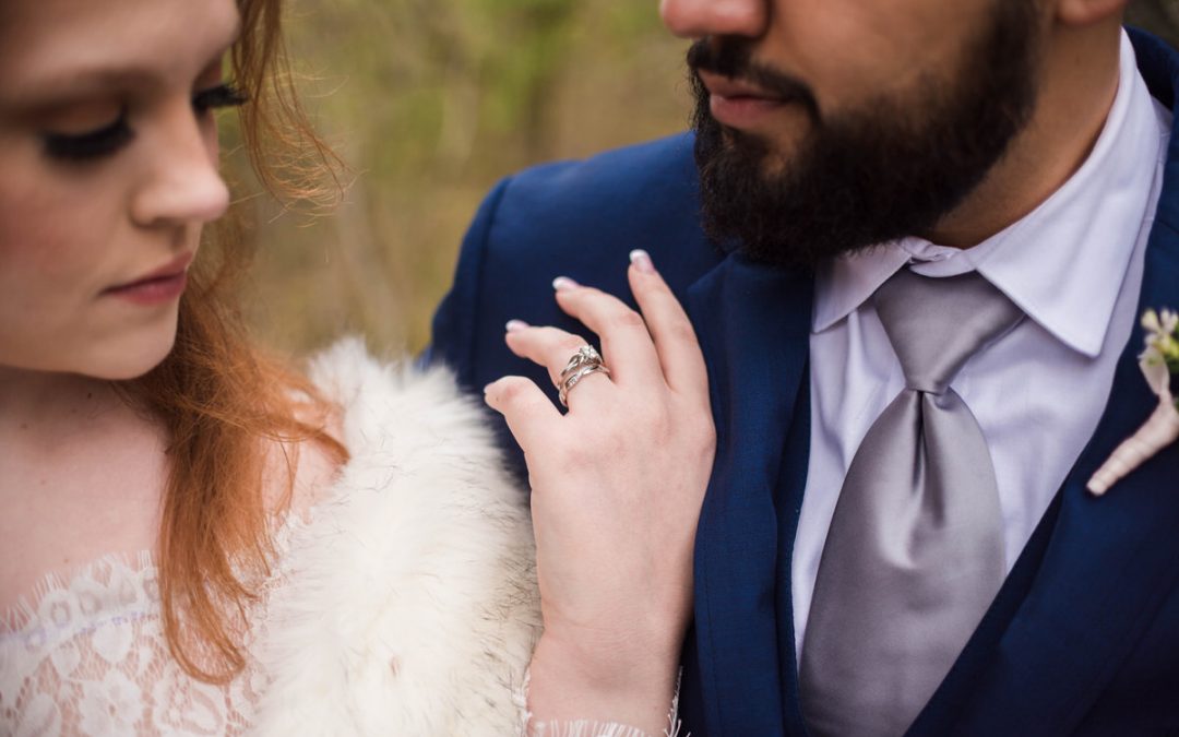 close up of brides hand on grooms chest