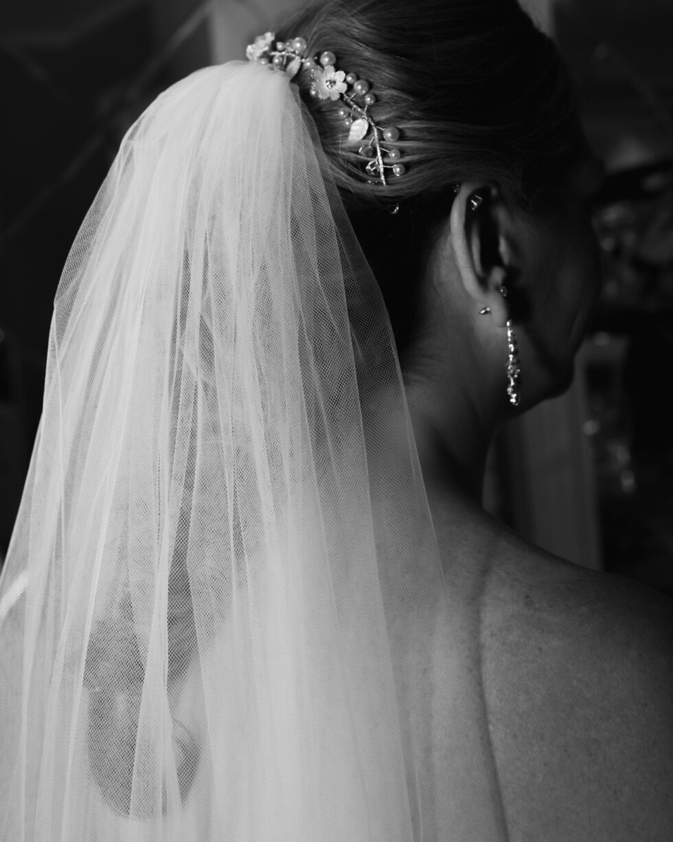 black and white image of a bride wearing a veil