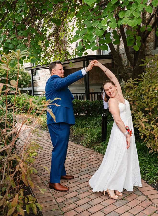 bride and groom dancing in garden