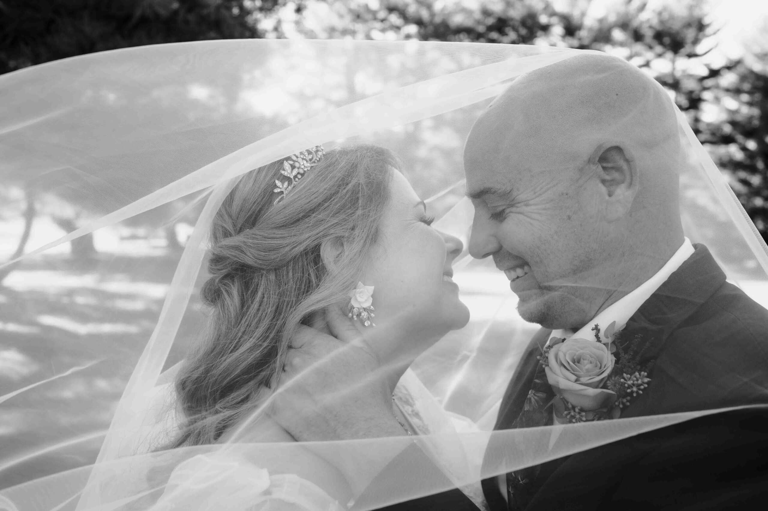 bride and groom under veil wedding photography in maryland